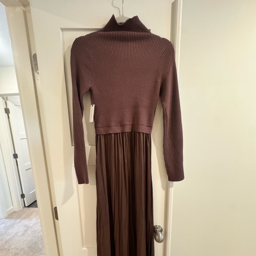 NWT never worn Anthropologie dress. Comfortable & flattering for any body shape